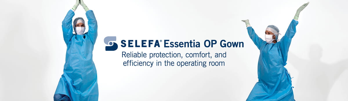 Two surgical professionals wearing blue SELEFA Essentia OP gowns raise their arms in a celebratory gesture, demonstrating the comfort and protective benefits of the surgical operating room apparel.