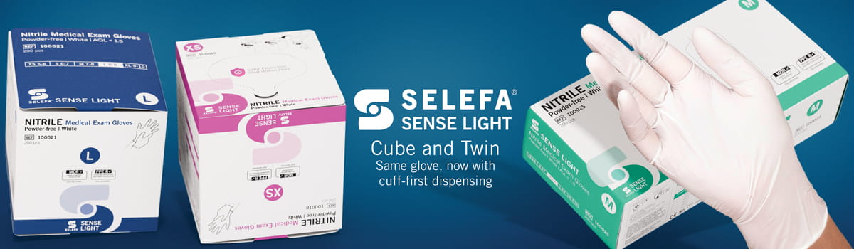 Banner showing SELEFA® Sense Light nitrile medical exam glove boxes in various sizes and colors, alongside a hand wearing a white glove, with text highlighting the Cube and Twin cuff first dispensing design.